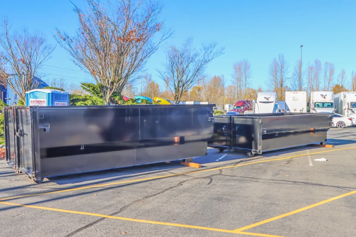 Professional dumpster rental service with roll-off container on residential driveway in Rio Rico